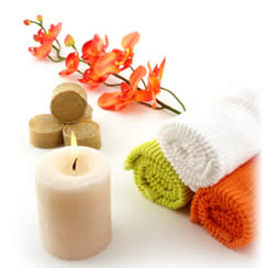 Photograph of relaxing, calming flowers and candles.